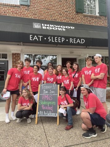 Shakespeare elective students pose outside of Inkwood Books after their reading
