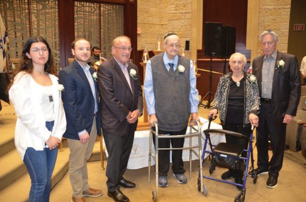 Joel Fabian, third from right, pictured with Holocaust survivors and descendants of Holocaust survivors at Congregation Beth El in May 2024.  